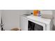 Bright laundry room featuring a white front-loading washing machine and dryer at 6211 W 28Th Ct, Wheat Ridge, CO 80214