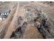 Aerial view of a home surrounded by mature trees, outbuildings, and a large lot at 18199 E 160Th Ave, Brighton, CO 80601