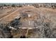 Aerial view of a home featuring a traditional roof and mature trees at 18199 E 160Th Ave, Brighton, CO 80601