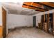 Unfinished basement featuring exposed beams, walls, and an in-need-of-repair wall with damaged drywall and visible infrastructure at 18199 E 160Th Ave, Brighton, CO 80601