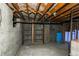 An unfinished basement with exposed ceiling beams offers an opportunity for renovation and customization at 18199 E 160Th Ave, Brighton, CO 80601
