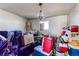 Cluttered bedroom with a hanging light fixture and a single window awaits renovation and organization at 18199 E 160Th Ave, Brighton, CO 80601