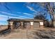 A large detached three-car garage with brown doors and brick siding at 18199 E 160Th Ave, Brighton, CO 80601