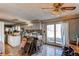 Spacious kitchen area leading to glass patio door with tile flooring and a retro ceiling fan at 18199 E 160Th Ave, Brighton, CO 80601