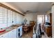 Small kitchen with wooden cabinets, tile floors, and sparse items scattered about at 18199 E 160Th Ave, Brighton, CO 80601