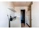 Laundry area with retro washer and dryer, shelving and white appliances at 18199 E 160Th Ave, Brighton, CO 80601