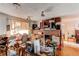 Living room with a brick fireplace, a window, and lots of random items at 18199 E 160Th Ave, Brighton, CO 80601