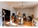 A large living room with hardwood floors and a decorative chandelier is ready for renovation at 18199 E 160Th Ave, Brighton, CO 80601