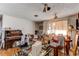Living room with an organ, a dining room table, a window, and random items scattered about at 18199 E 160Th Ave, Brighton, CO 80601