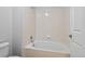 Bright, clean bathroom with tiled shower-tub combination and white porcelain fixtures at 23451 E 5Th Dr # 203, Aurora, CO 80018
