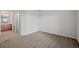 Spacious bedroom with neutral carpet and view to en-suite bathroom at 23451 E 5Th Dr # 203, Aurora, CO 80018