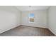 Bedroom featuring neutral walls and carpet with a bright window at 23451 E 5Th Dr # 203, Aurora, CO 80018