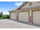 Three-car garage with brick pillar accents at 23451 E 5Th Dr # 203, Aurora, CO 80018