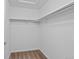 White walk-in closet with carpet, shelving, and bars at 23451 E 5Th Dr # 203, Aurora, CO 80018
