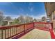 Red back deck overlooking a leafy yard and neighborhood views, with clear skies in the background at 13086 E Alaska Ave, Aurora, CO 80012