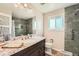 Updated bathroom with granite countertops, and modern fixtures with a marble tiled shower at 13086 E Alaska Ave, Aurora, CO 80012