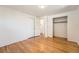 Empty bedroom with closet space and hardwood floors, ready for a personal touch at 13086 E Alaska Ave, Aurora, CO 80012