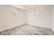 Light bedroom with plank floors and two windows allowing plenty of natural light at 13086 E Alaska Ave, Aurora, CO 80012