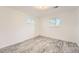 Bright bedroom with plank floors and two windows allowing plenty of natural light at 13086 E Alaska Ave, Aurora, CO 80012