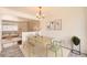 Bright dining room with modern light fixture and dining set perfect for entertaining guests at 13086 E Alaska Ave, Aurora, CO 80012