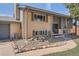 Charming two-story home features a well-maintained lawn and traditional brick facade at 13086 E Alaska Ave, Aurora, CO 80012