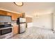 Well-lit kitchen with stainless steel appliances and modern tile backsplash at 13086 E Alaska Ave, Aurora, CO 80012