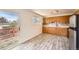 Bright kitchen features ample cabinetry, stainless steel refrigerator, and access to the deck at 13086 E Alaska Ave, Aurora, CO 80012