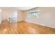 Spacious living room featuring hardwood floors and a large window, perfect for natural light at 13086 E Alaska Ave, Aurora, CO 80012