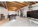 Unfinished basement with exposed ceiling, gray walls, and a large window for natural light at 13220 E 110Th Pl, Commerce City, CO 80022