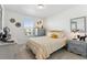 Bright bedroom with a comfortable bed, stylish bedding, and decorative wall art at 13220 E 110Th Pl, Commerce City, CO 80022