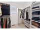 Organized walk-in closet with hanging rods, shelves and a window for natural light at 13220 E 110Th Pl, Commerce City, CO 80022