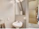 Cozy bathroom featuring a pedestal sink, mirror, and neutral wall color at 3736 N Mariposa St, Denver, CO 80211