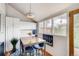 Bright dining area featuring updated storage, a window with neighborhood views, and wood floors at 3736 N Mariposa St, Denver, CO 80211