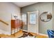 Charming entryway features a unique cabinet and a decorative cowhide rug near a white door at 3736 N Mariposa St, Denver, CO 80211