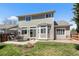 Spacious backyard with a patio, seating area, and well-manicured lawn at 19064 E Oak Creek Way, Parker, CO 80134