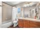 Updated bathroom featuring a tub, shower, and wood-look flooring at 19064 E Oak Creek Way, Parker, CO 80134