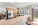 Kitchen with stainless steel appliances, wooden cabinetry, and tiled countertops at 19064 E Oak Creek Way, Parker, CO 80134