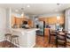 Well-lit kitchen with stainless steel appliances and wood floors at 19064 E Oak Creek Way, Parker, CO 80134