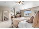Comfortable main bedroom featuring a ceiling fan and neutral wall colors at 19064 E Oak Creek Way, Parker, CO 80134