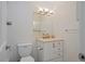Bright bathroom featuring a vanity with drawers, a modern faucet, and a stylish mirror with lighting at 9255 E Lehigh Ave # 194, Denver, CO 80237