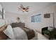 This bedroom features a carpeted floor, ceiling fan, window and modern furniture at 9255 E Lehigh Ave # 194, Denver, CO 80237
