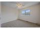 Bedroom with neutral carpet, ceiling fan and a window bringing in natural light at 9255 E Lehigh Ave # 194, Denver, CO 80237