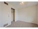 Bedroom featuring a closet, carpet flooring, a ceiling fan with overhead light, and neutral wall paint at 9255 E Lehigh Ave # 194, Denver, CO 80237