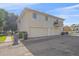 Two-story home featuring an attached garage, a small balcony, and light siding at 9255 E Lehigh Ave # 194, Denver, CO 80237