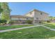Well-maintained exterior showcasing lawn, landscaped beds, and tidy siding at 9255 E Lehigh Ave # 194, Denver, CO 80237
