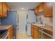Modern kitchen features stainless steel appliances, updated cabinets, countertops, and a convenient washer/dryer at 9255 E Lehigh Ave # 194, Denver, CO 80237
