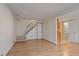 Inviting living room featuring hardwood floors and easy access to the stairway and half bathroom at 9255 E Lehigh Ave # 194, Denver, CO 80237