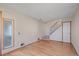 Inviting living room featuring hardwood floors and a stairway with black iron railing at 9255 E Lehigh Ave # 194, Denver, CO 80237