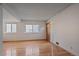 Bright living room featuring hardwood floors, a front door, and well-lit windows at 9255 E Lehigh Ave # 194, Denver, CO 80237