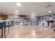 Spacious basement with laminate flooring and ample storage bins and shelving at 5758 Echo Park Cir, Castle Rock, CO 80104